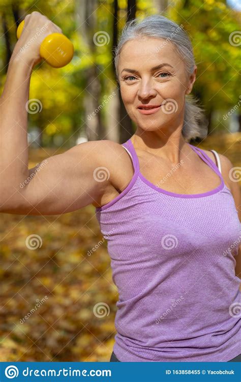 Smiling Athletic Tranquil Woman Flexing Her Arm Stock Image Image Of