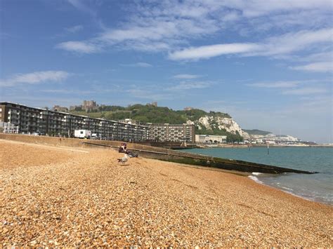 The Beach In Dover With Dover Castle Overlooking White Cliffs Of Dover And The Ferry To