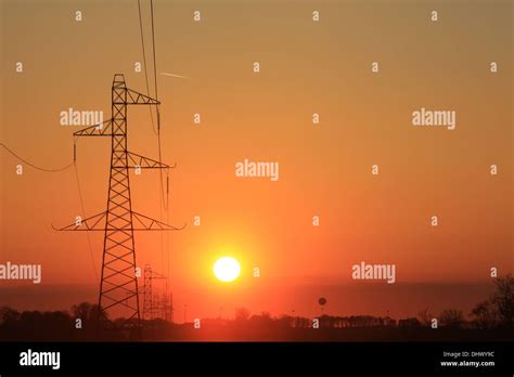 Electricity Pylons Sunset Stock Photo Alamy