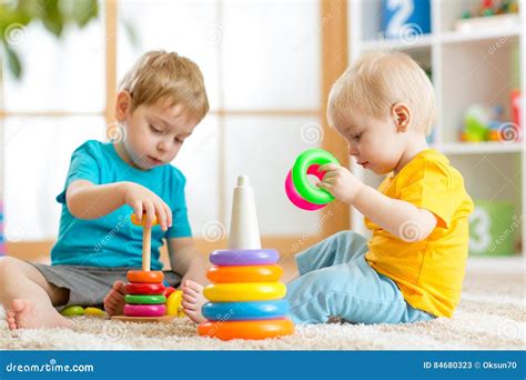 Children Playing Together Toddler Kid And Baby Play With Blocks