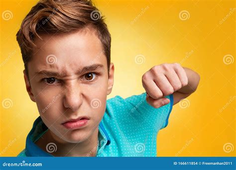 Emotions And Transitional Age Close Up Portrait Of A Teenage Boy In A