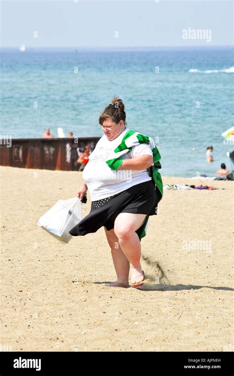Obese Woman Walking On The Beach In Wisconsin Stock Photo Alamy