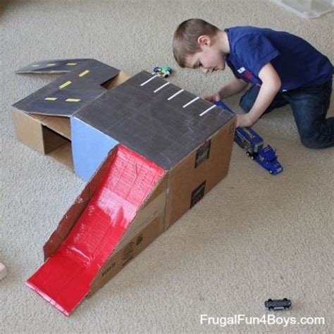 Hotwheels parking garage, homemade with recycled materials such as cardboard, plastic rolls, recycled sheets etc. Cardboard Box Hot Wheels Car Garage with Ramps | Toy ...