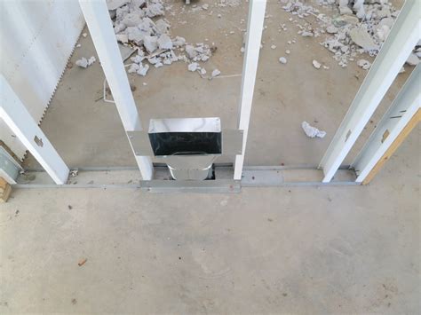 Spiral hvac duct with storm collar for a clean look on through wall installation. Our Lake Fortress: Garage slab and HVAC roughs completed