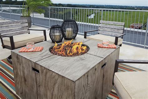 Firepit tables can burn wood, natural gas, or propane gas for fuel. Peachstone Square Fire Pit Table Set Signature Design ...