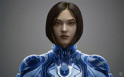 A Woman In A Futuristic Blue Suit With Her Hands On Her Hips