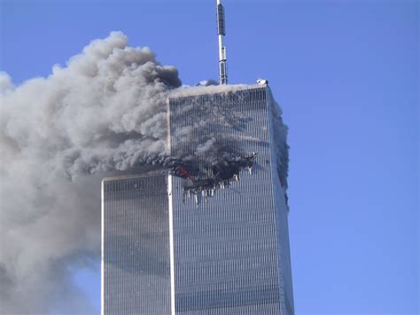 Smoke And Fire Rising From The Visible Impact Of The Plane Into World