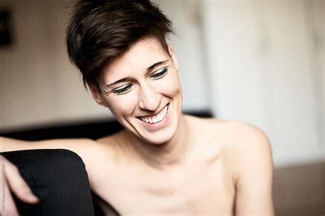 Short Haired Smiling Woman Looking Down By Stocksy Contributor Guille Faingold Stocksy