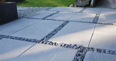 A new stone patio can completely transform the look of your property. Concrete patio stones and river rocks | Patio stones ...