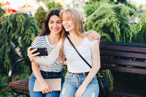 Friends Making Selfie Two Beautiful Young Women Making Selfie Stock Image Image Of Park