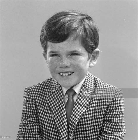 American Child Actor Butch Patrick Wears A Checked Jacket And Tie In