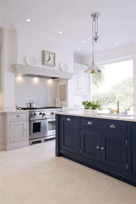 The colours are lovely and so calm and restful. Luxury blue painted kitchen with feature island with full ...
