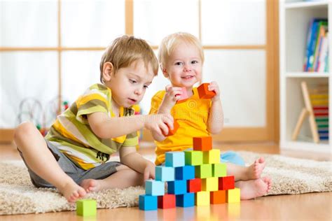 Preschooler Children Playing With Colorful Toy Blocks Kid Playing With