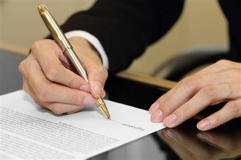 Premium Photo Businessman Hand Signing A Contract Paper