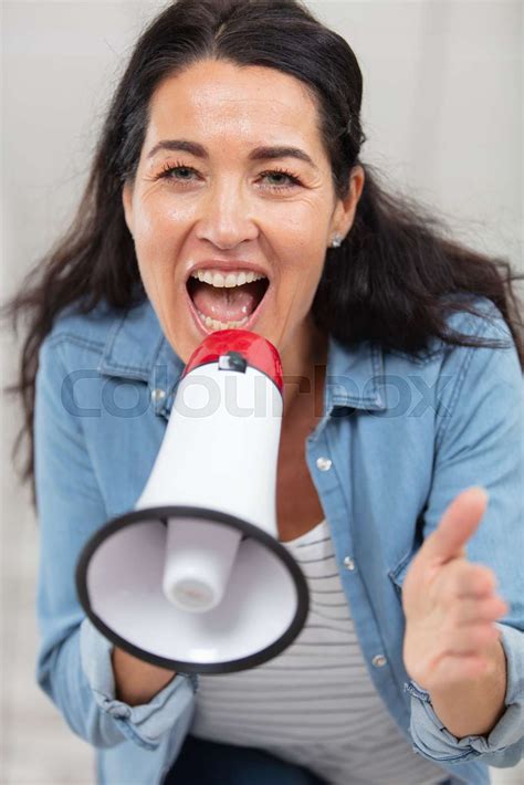 Middle Aged Woman Yelling Through Megaphone Stock Image Colourbox