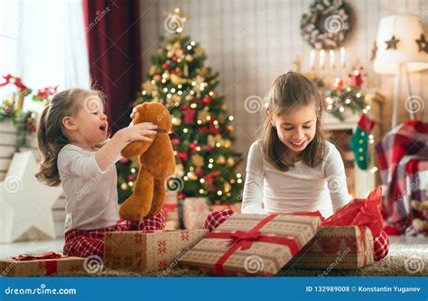 Girls Opening Christmas Ts Stock Photo Image Of Present Room