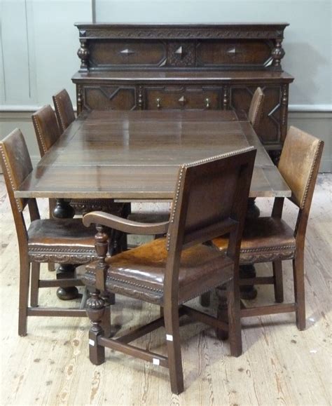 A 192030s Oak Dining Room Suite Comprising A Extending Dining Table On