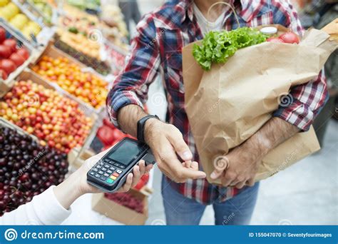 Paying By Smartwatch In Supermarket Stock Photo - Image of customer ...
