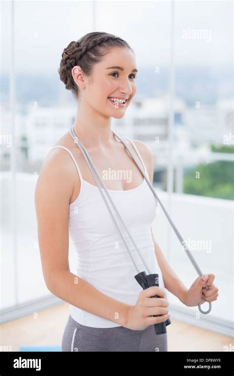 Cheerful Sporty Brunette Holding Skipping Rope Stock Photo Alamy