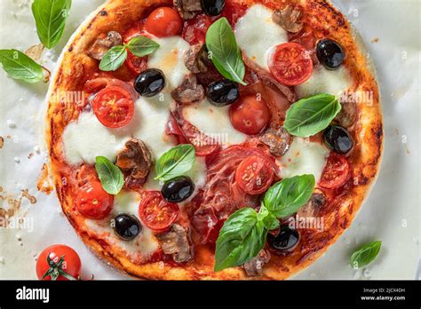 Fresh And Crunchy Pizza Capricciosa With Mozzarella Tomatoes And