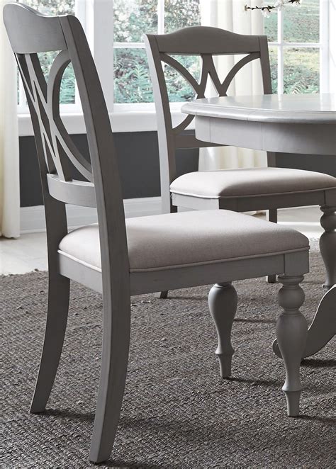 For a strong yet understated look, consider a gray chair for your living room. Summer House Dove Grey Upholstered Side Chair Set of 2 ...