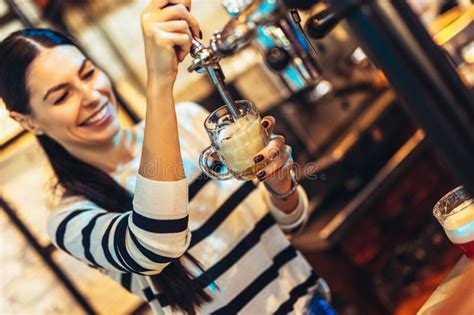 Female Bartender Tapping Beer In Bar Stock Photo Image Of Female