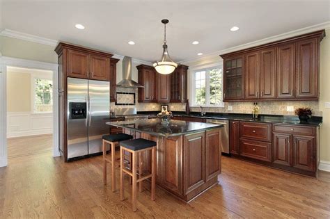 Laminate cabinets can be purchased in a variety of designs, according to kitchen cabinet kings, but real wood looks more natural. Difference between Cabinet Refacing and Refinishing