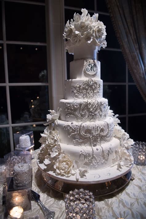 To assemble the cakes, you'll need a 30cm/12in cake drum, 16 dowelling rods, three 12cm/4½in thin cake board and three 12cm/4½in polystyrene cake spacers covered in ribbon. Extravagant Six Tier Ivory Wedding Cake