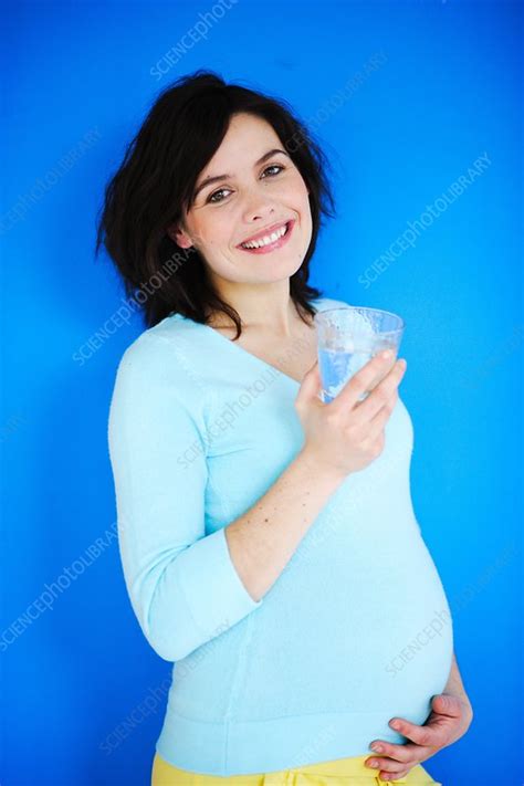 Pregnant Woman Drinking Water Stock Image C0314680 Science Photo