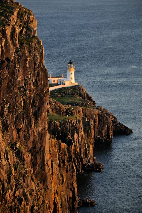 Neist point lighthouse has been located there since 1909. Neist Point Lighthouse at sunset, the Isle of Skye, Scotla ...