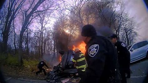 Bodycam Video Shows Police In Kansas Pulling Woman From Burning Vehicle