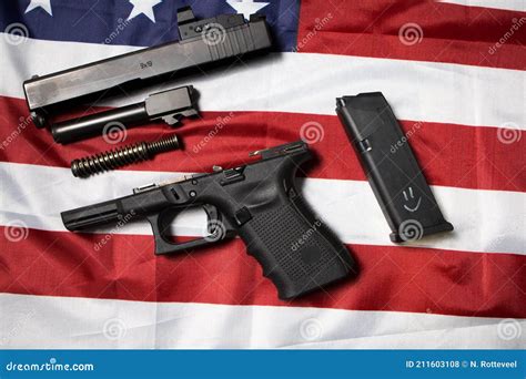 Closeup Of Disassembled Pistol On The American Flag Gun Laws In The