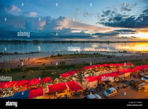 A View Over The Mekong River And Night Market At The Riverside In The
