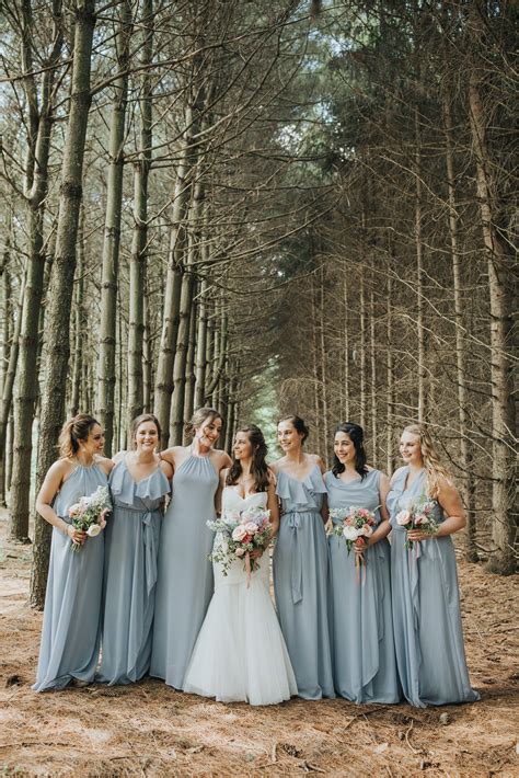 Bridesmaids In Mismatched Dusty Blue Dresses Wedding Portrait
