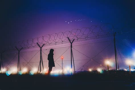 Night Lights Person Standing Behind Fence Silhouetee Hd Photography
