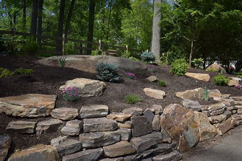 Today, we will be giving you some landscape retaining wall ideas to check out. Natural Stone Retaining Walls | Naturescapes Landscape ...