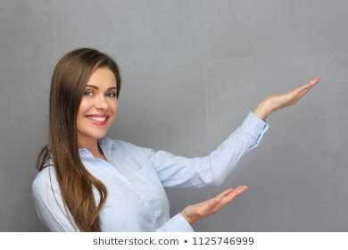 Smiling Woman Showing Empty Hands Space Stock Photo