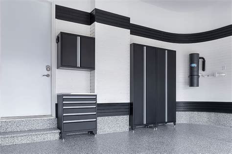 Give your tractor some relief from the weather. Black Signature cabinet along a curved wall | Garage ...