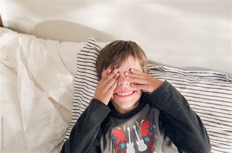 Boy Covers Eyes By Stocksy Contributor Maria Manco Stocksy