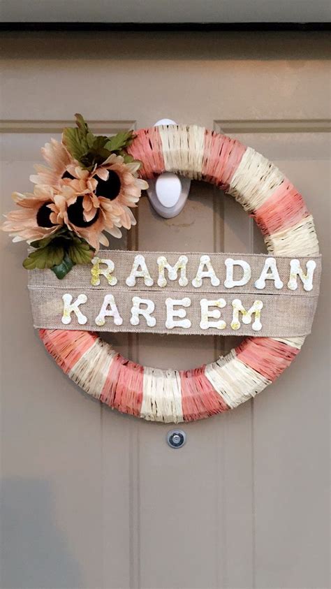 A Wooden Sign That Says Raman Kareem Hanging On A Door With Flowers