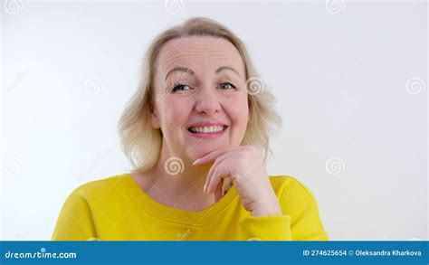 Portrait Of A Joyful And Cheerful Cute European Curly Haired Blonde Woman Who Jokes Cheerfully