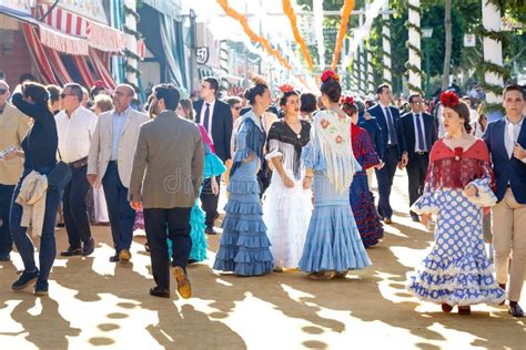 People Dressed In Traditional Spanish Costumes Celebrating The Seville