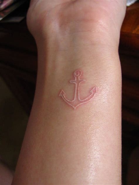 It looks cool much like an imprint and is almost barely noticeable, but once it does get seen, the beautiful white cross never fails to leave a lasting impression to anyone who catches a glimpse of it. Small white ink anchor tattoo on wrist
