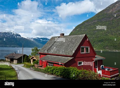 Typical Red Wooden House On The Hardanger Fjord Norway Scandinavia