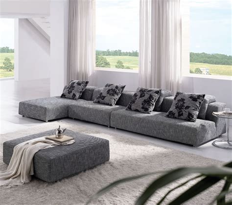 The leana 3 seater sofa is a staple for those looking to create a comfy living room. Contemporary Zebrano Grey Solid Fabric Sectional Sofa with Ottoman Urban Comfy