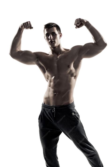 Premium Photo Muscular Man Posing Flexing His Biceps Showing