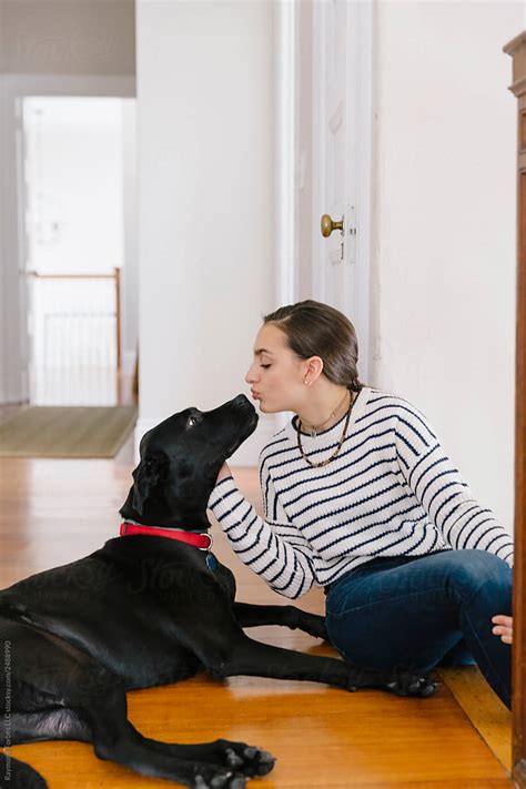 Teen Girl Giving Her Dog A Kiss By Stocksy Contributor Raymond