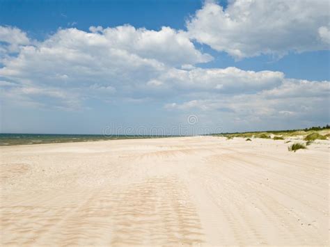 Baltic Sea Coast Blue Sea White Yellow Sand Clouds And Dunes Stock