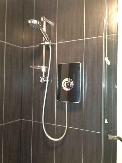 It's a basic procedure that includes putting up proper backing, mortaring the tile to the wall, letting it dry, and then applying the grout to. This bathroom installation took place in Holbrooks Coventry.