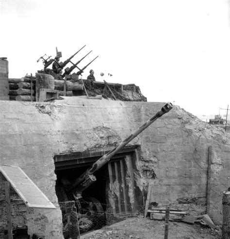 A Damaged German Bunker Still Home To A Pak 43 Field Gun Derived From